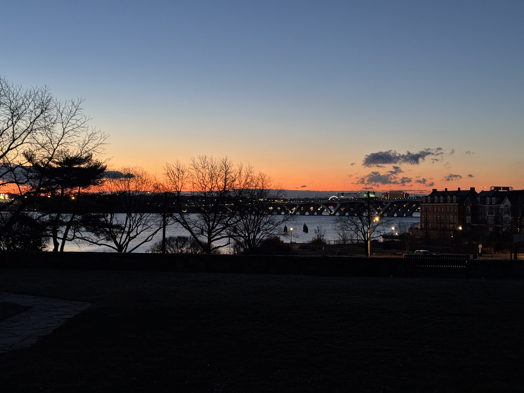 sunrise sky. Woodrow Wilson bridge over the primary river. National harbor on the opposite bank