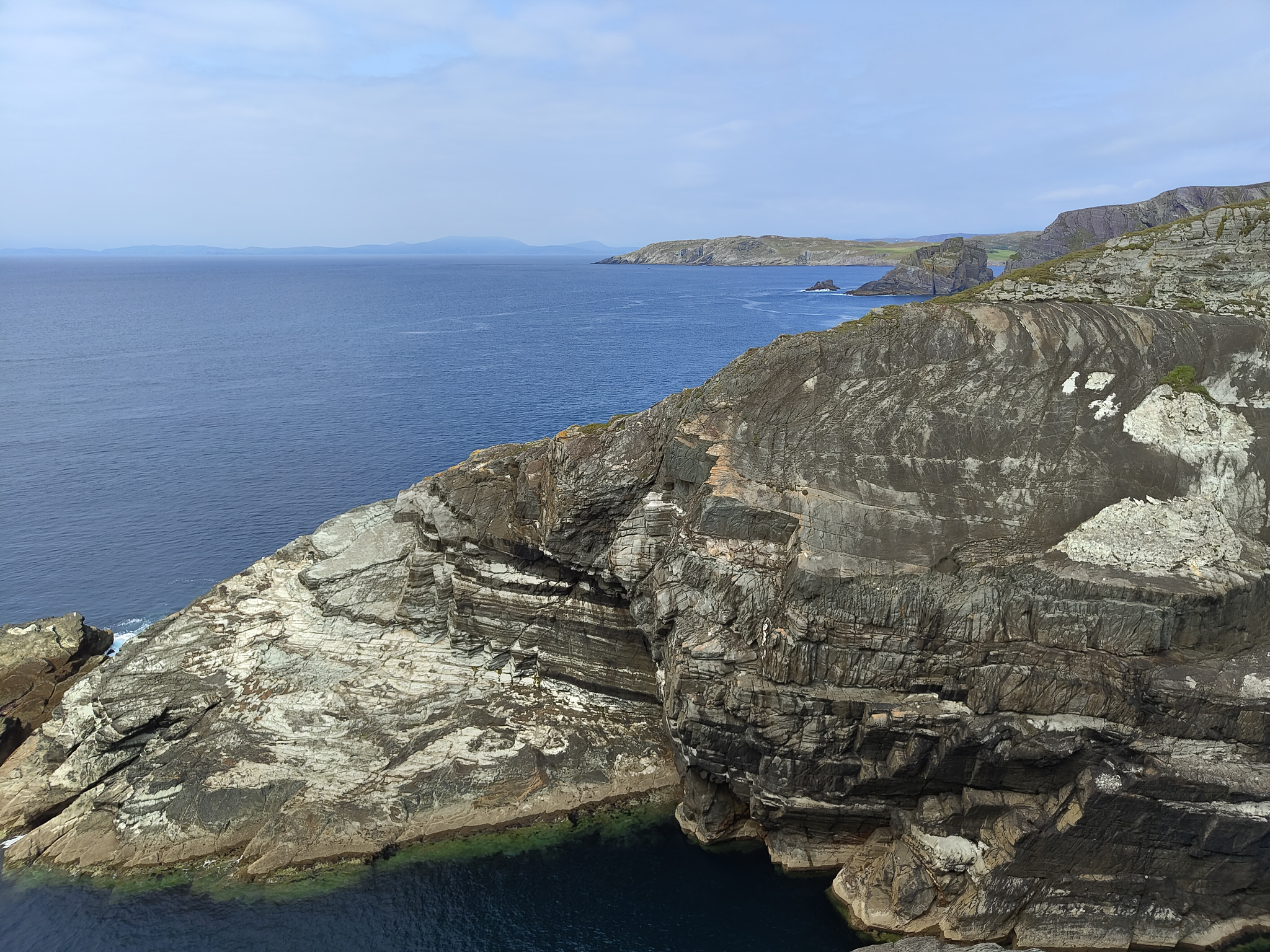 Bare, craggy outcrops reaching into the Atlantic Ocean like claws or gigantic whales