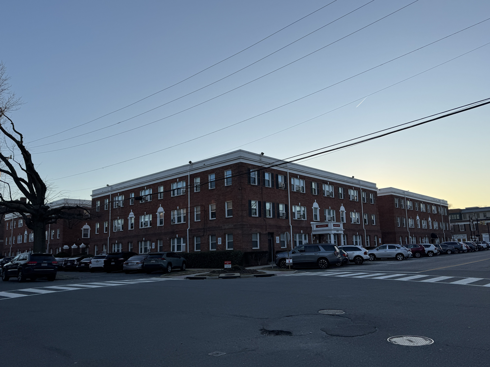 three story brick apartment building on the corner