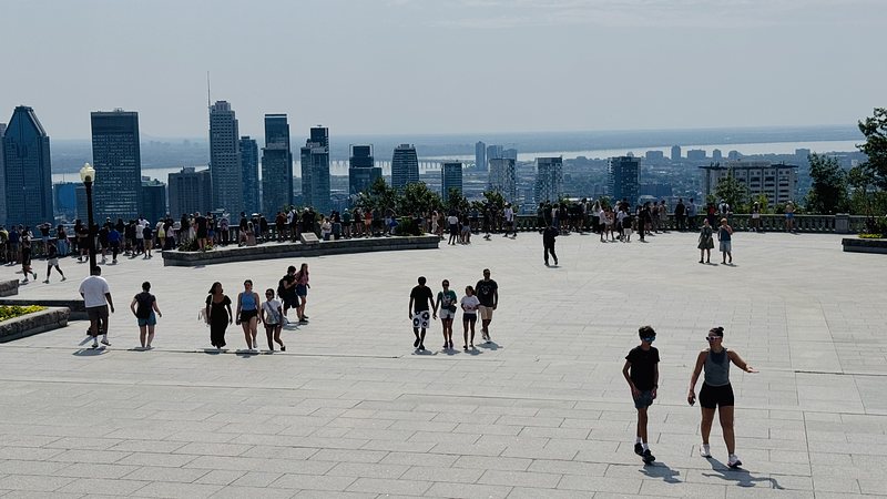 This is the best place to see Montreal city: from the terrace at the top of Mount Royal. I go there many times a year, essentially all seasons except winter. Hot summer day today.