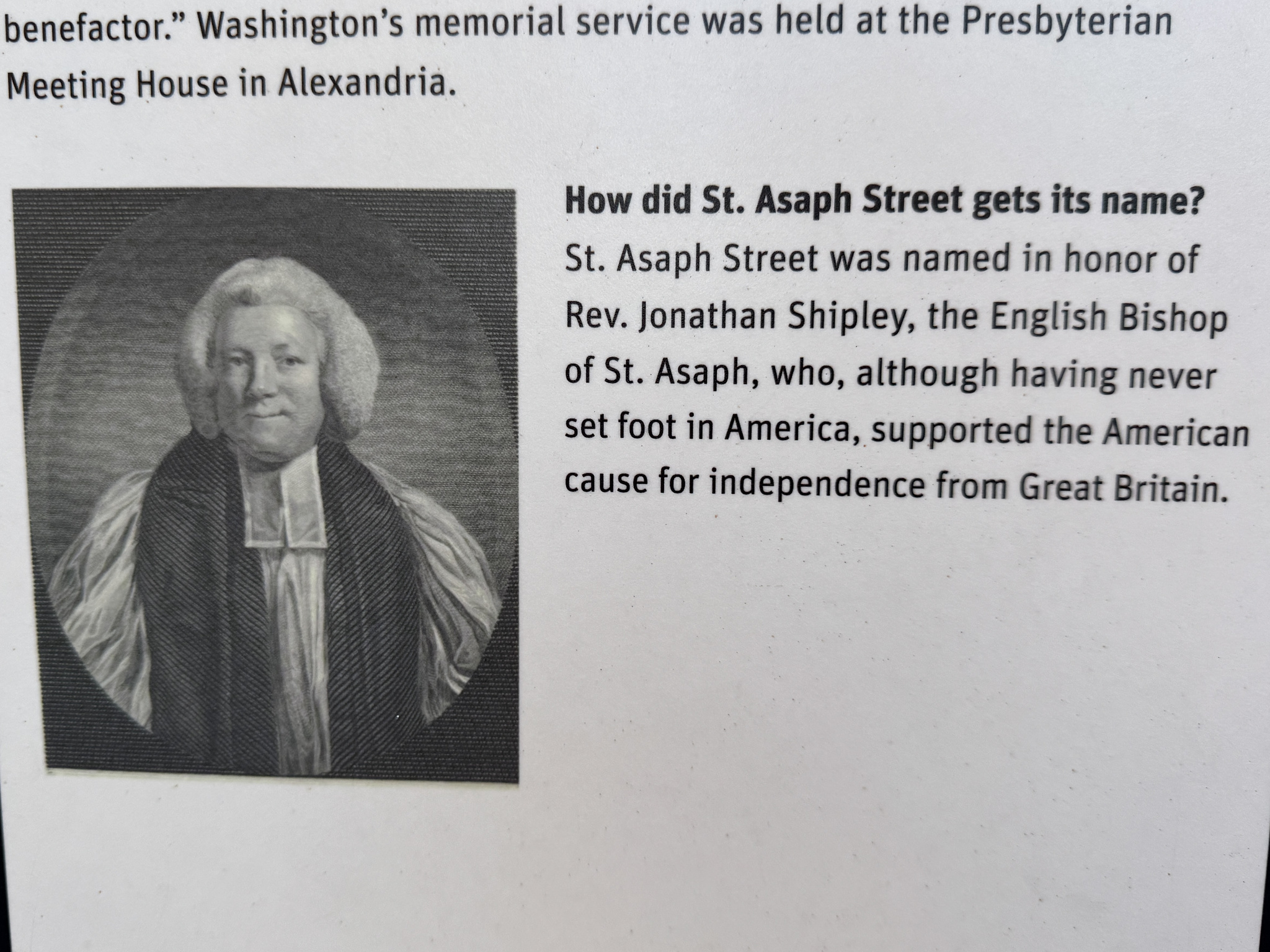 Sign that reads: How did St. Asaph Street get its name? St. Asaph Street was named in honor of Rev. Jonathan Shipley, the English Bishop of St. Asaph, who, although having never set foot in America, supported the American cause for independence from Great Britain. 