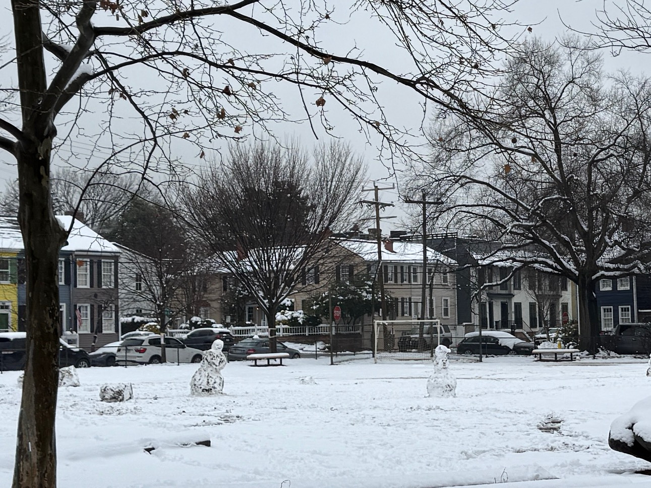 school playground with two large snowmen