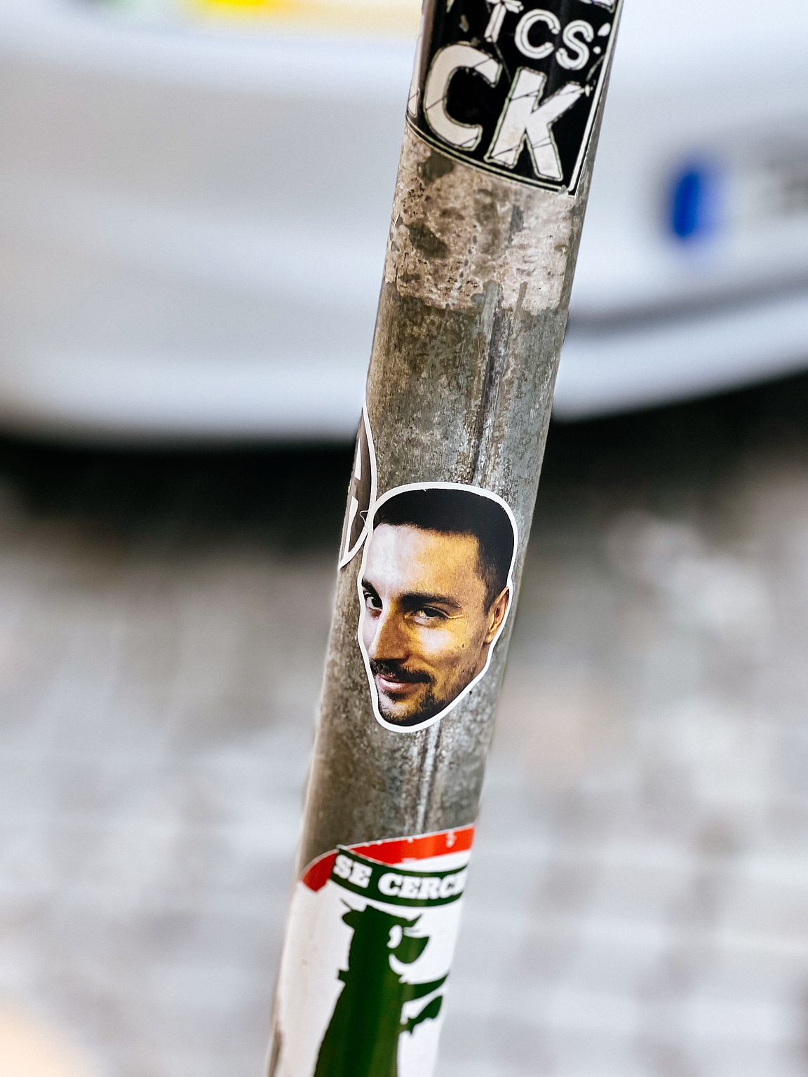 Sticker with a photo of a man's face. 