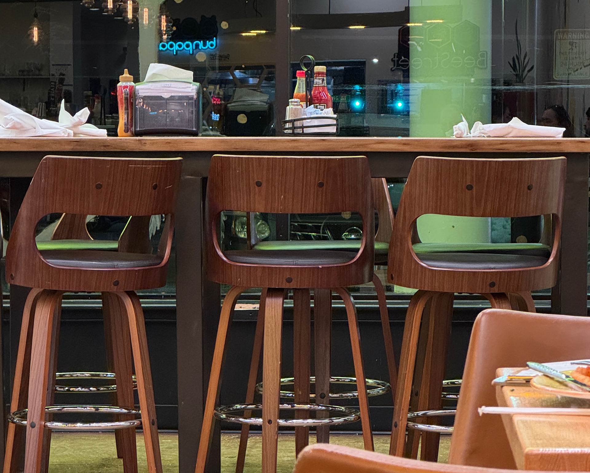 bar stools that look like they have eyes and wide open mouths