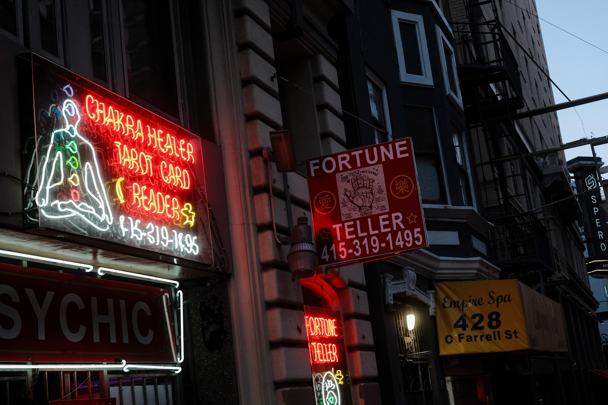 A neon fortune teller and chakra healing sign