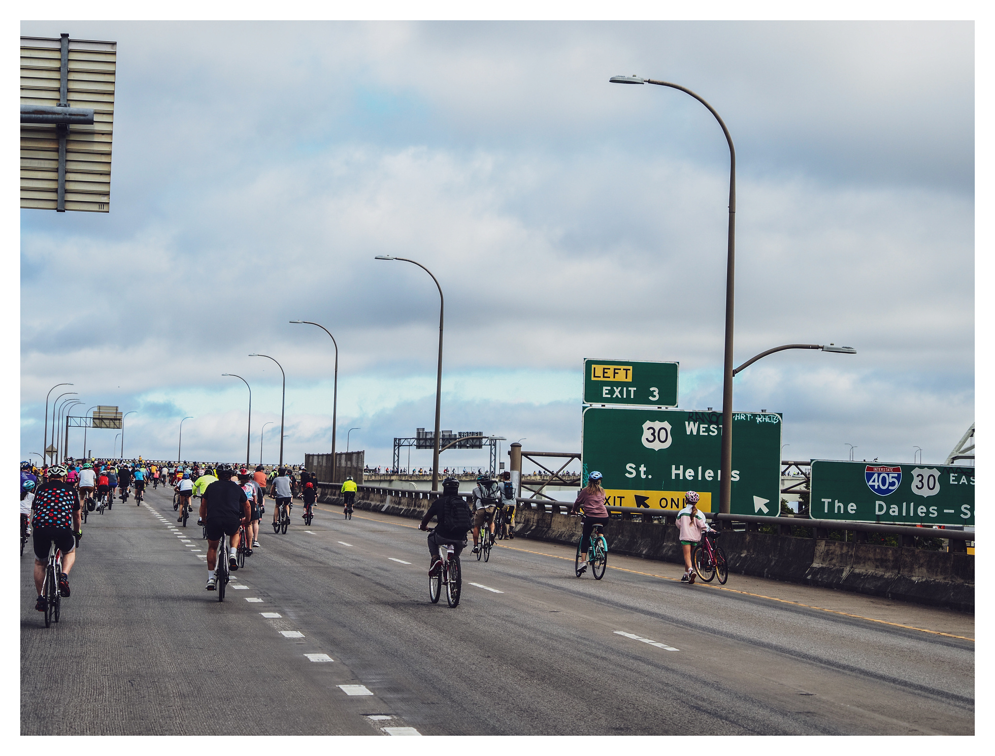 Bicyclists pedaling up I405 toward the Fremont Bridge. 