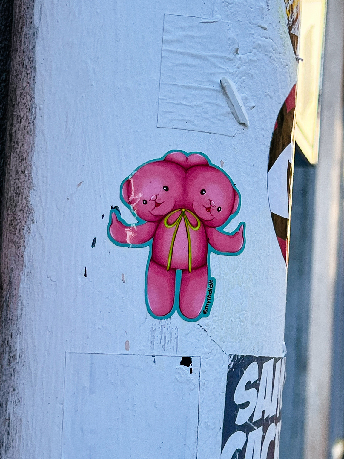 A pink teddy bear, with two heads.