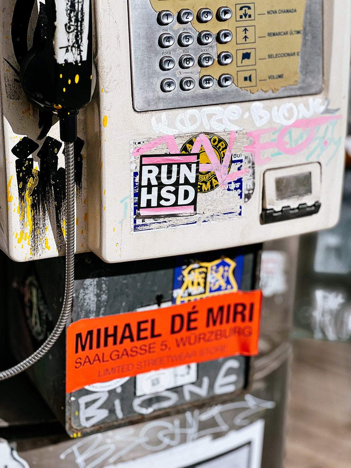 Pay phone with stickers. 