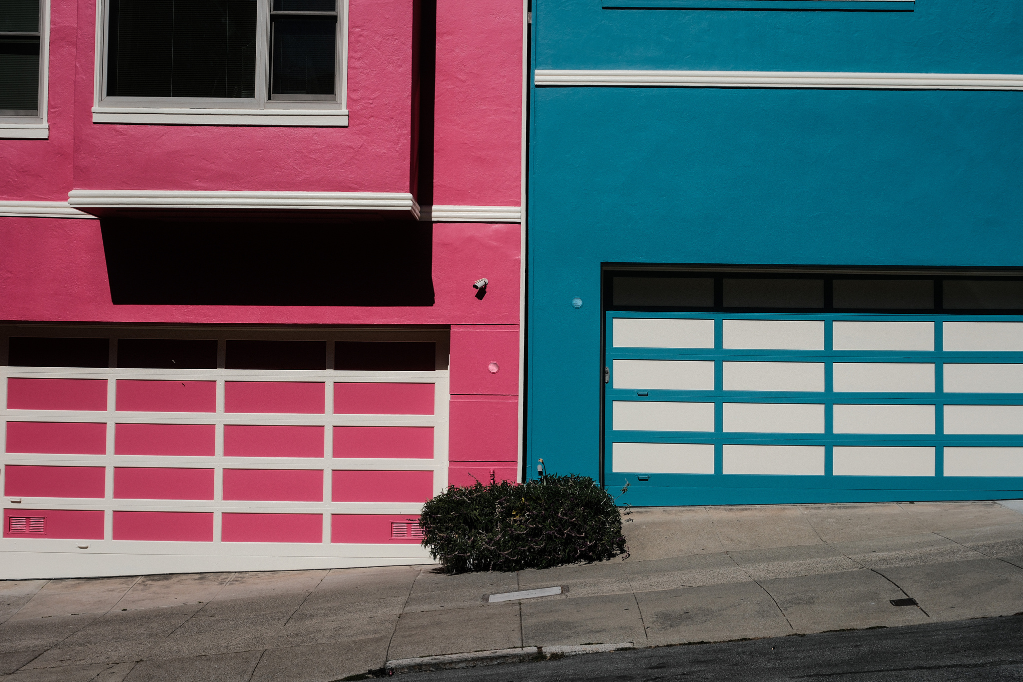 Bright pink and turquoise blue garage doors