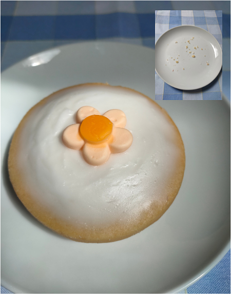 Photo of a large empire biscuit, sitting on a white plate.  A small insert photo top right showing the same plate with crumbs