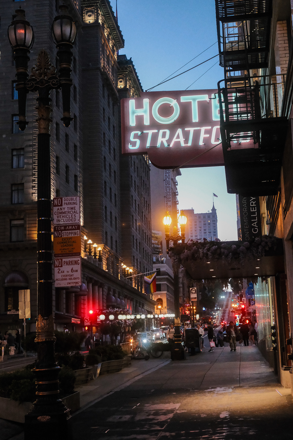 A blue and white neon sign that reads "Hotel Stratford"