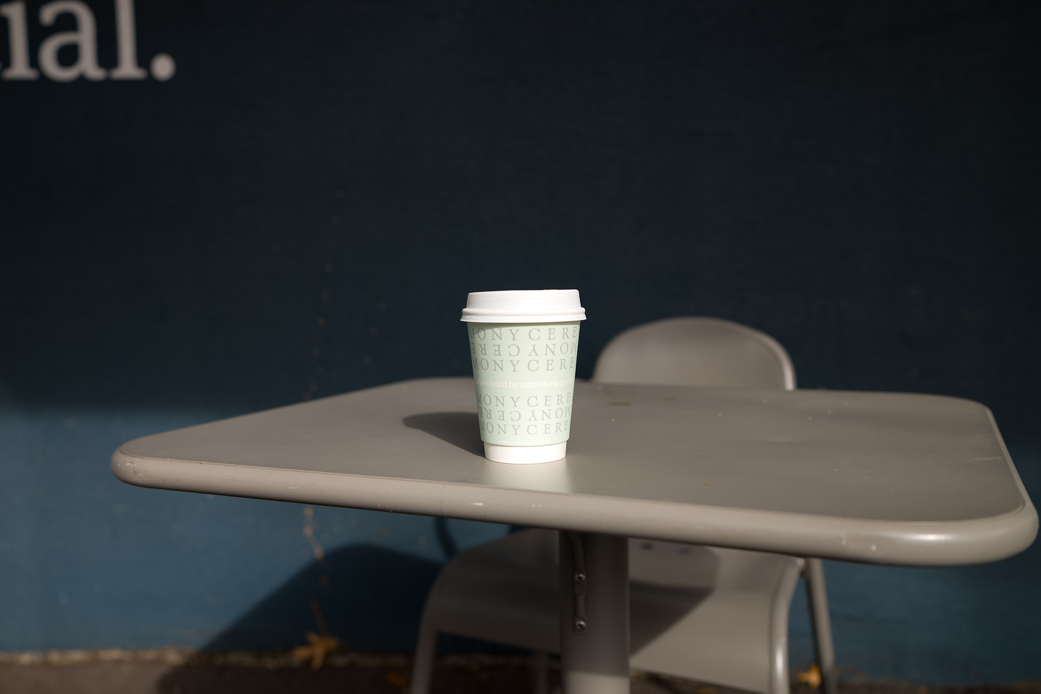 A cup of coffee in the sunlight on a table