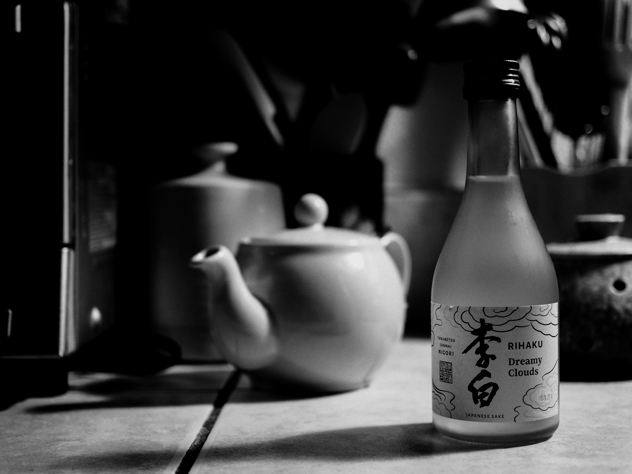 Monochrome. A bottle of Rihaku sake