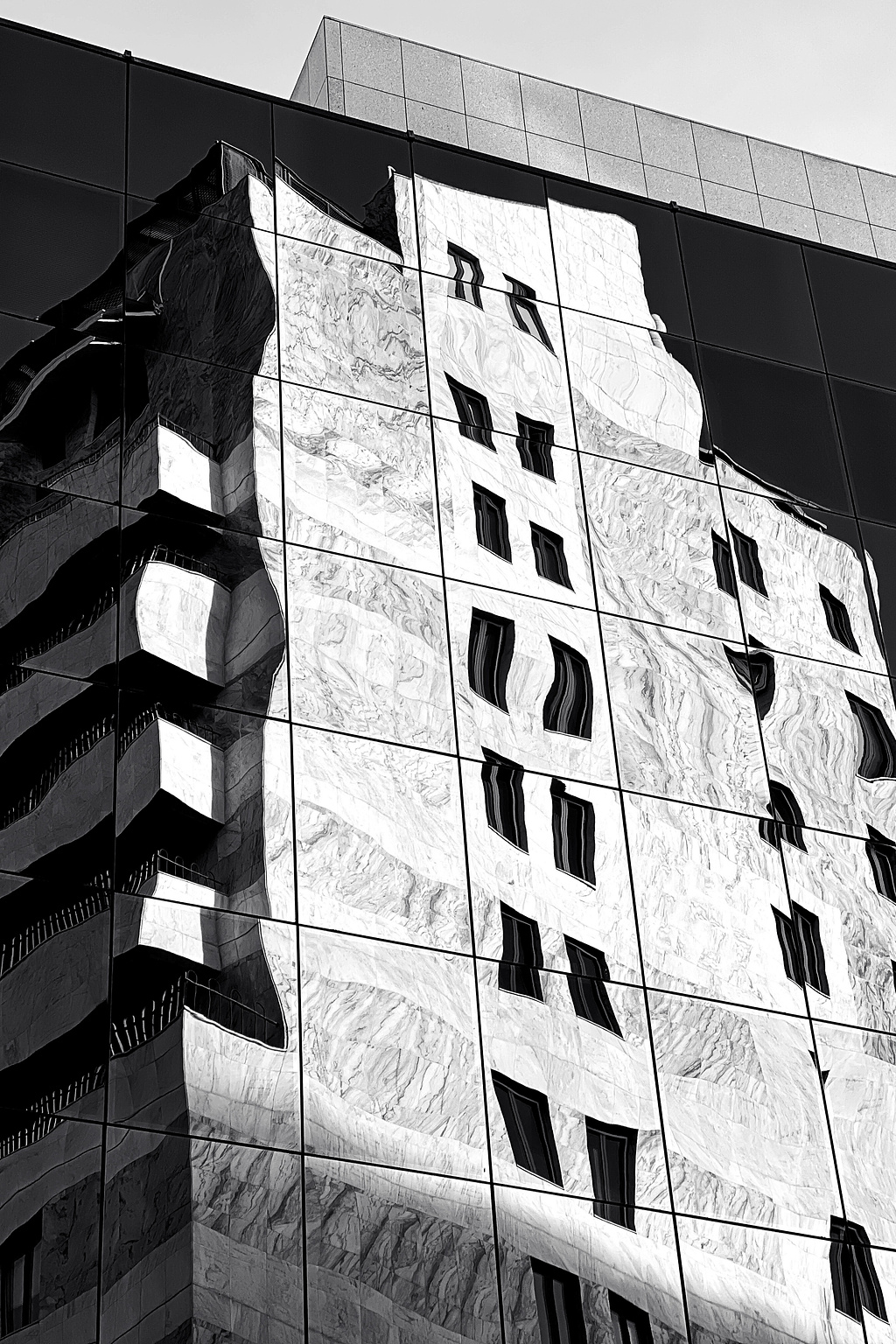 A building reflected on another building.