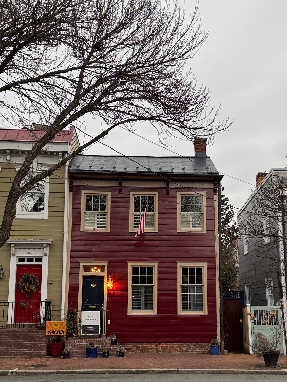 red, wooden, 19th century townhome