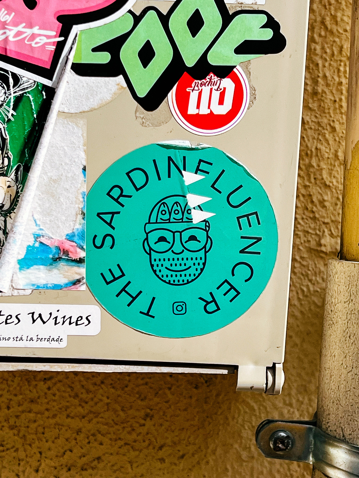 "The Sardinefluencer", and a face with a hat with sardines on it. 