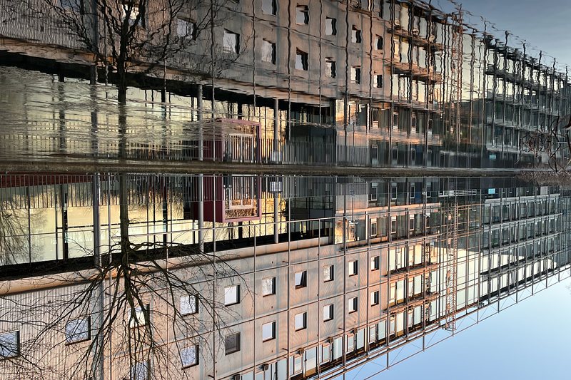 Reflection of a building in the water, turned upsidedown.