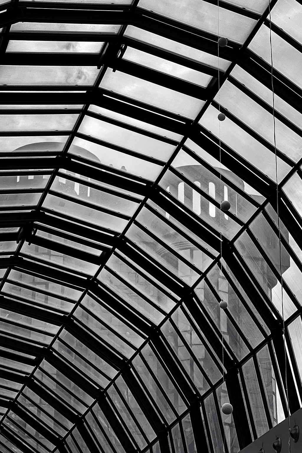 A building seen through a window. 