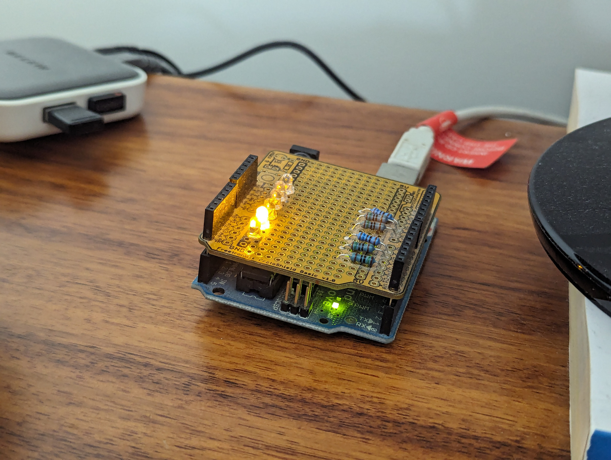 The amber LED, indicating a build in progress.