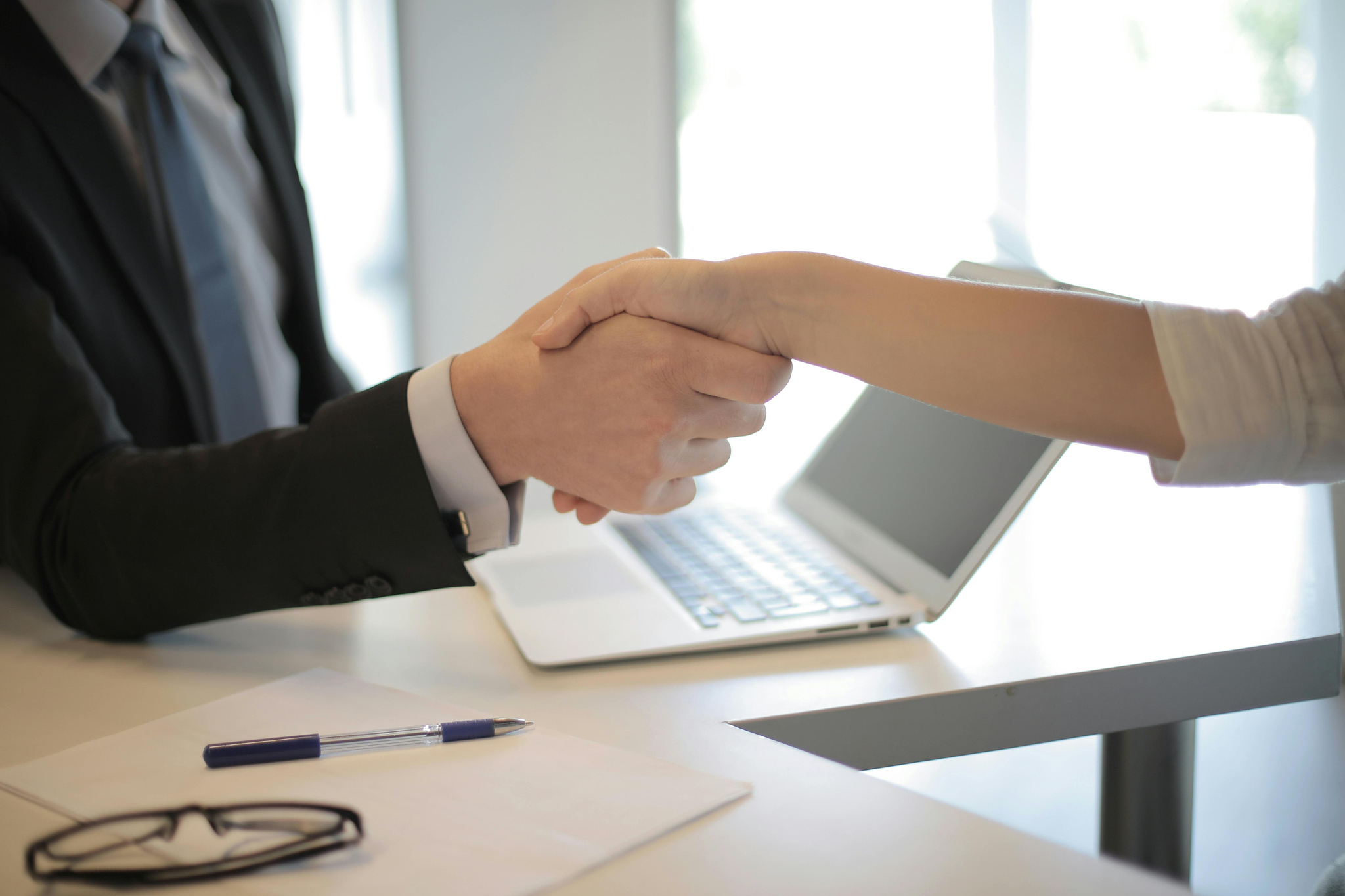 Person in black suit hired an employee