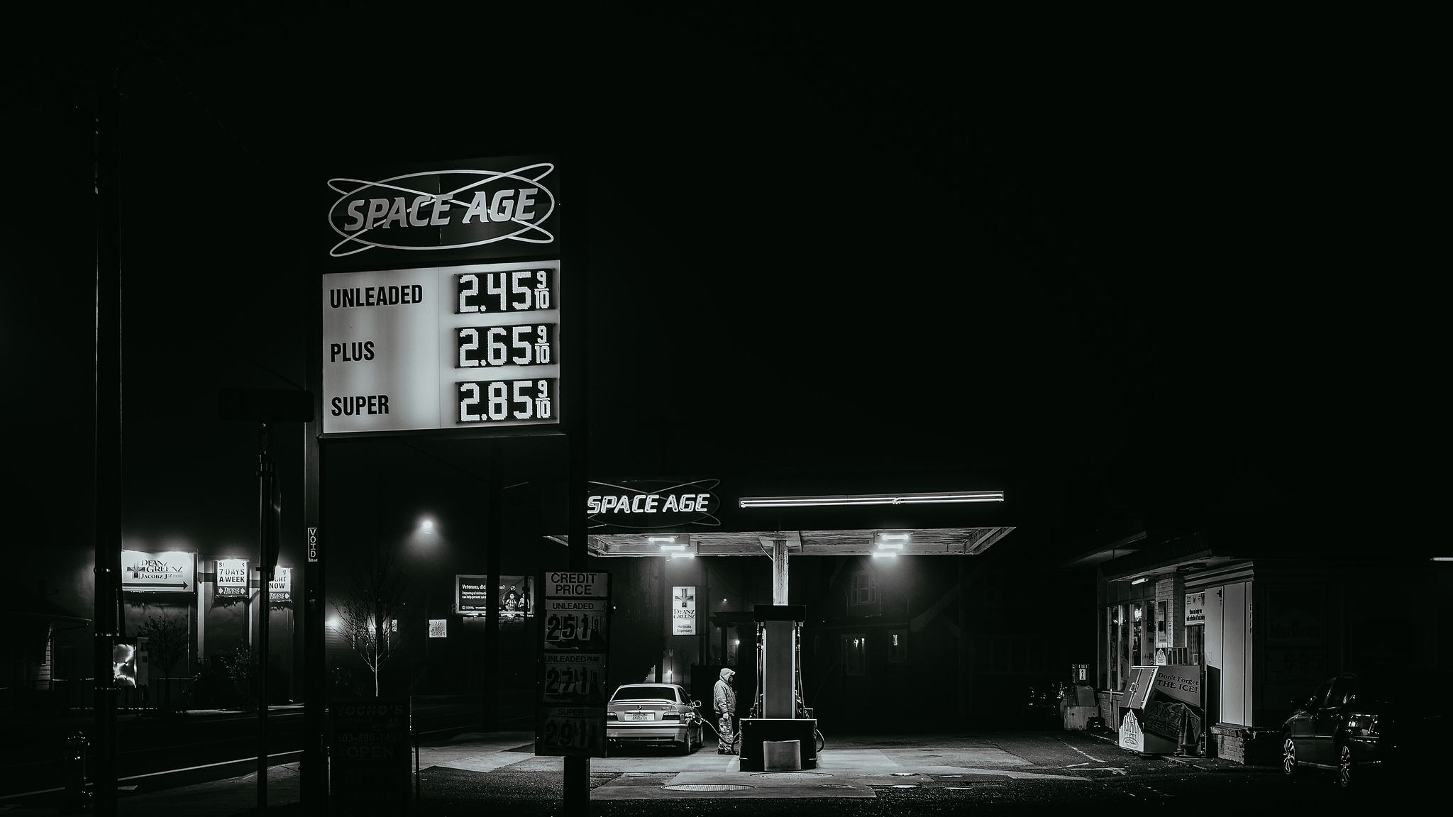 Monochrome. A Space Station gas station on a winter night. 