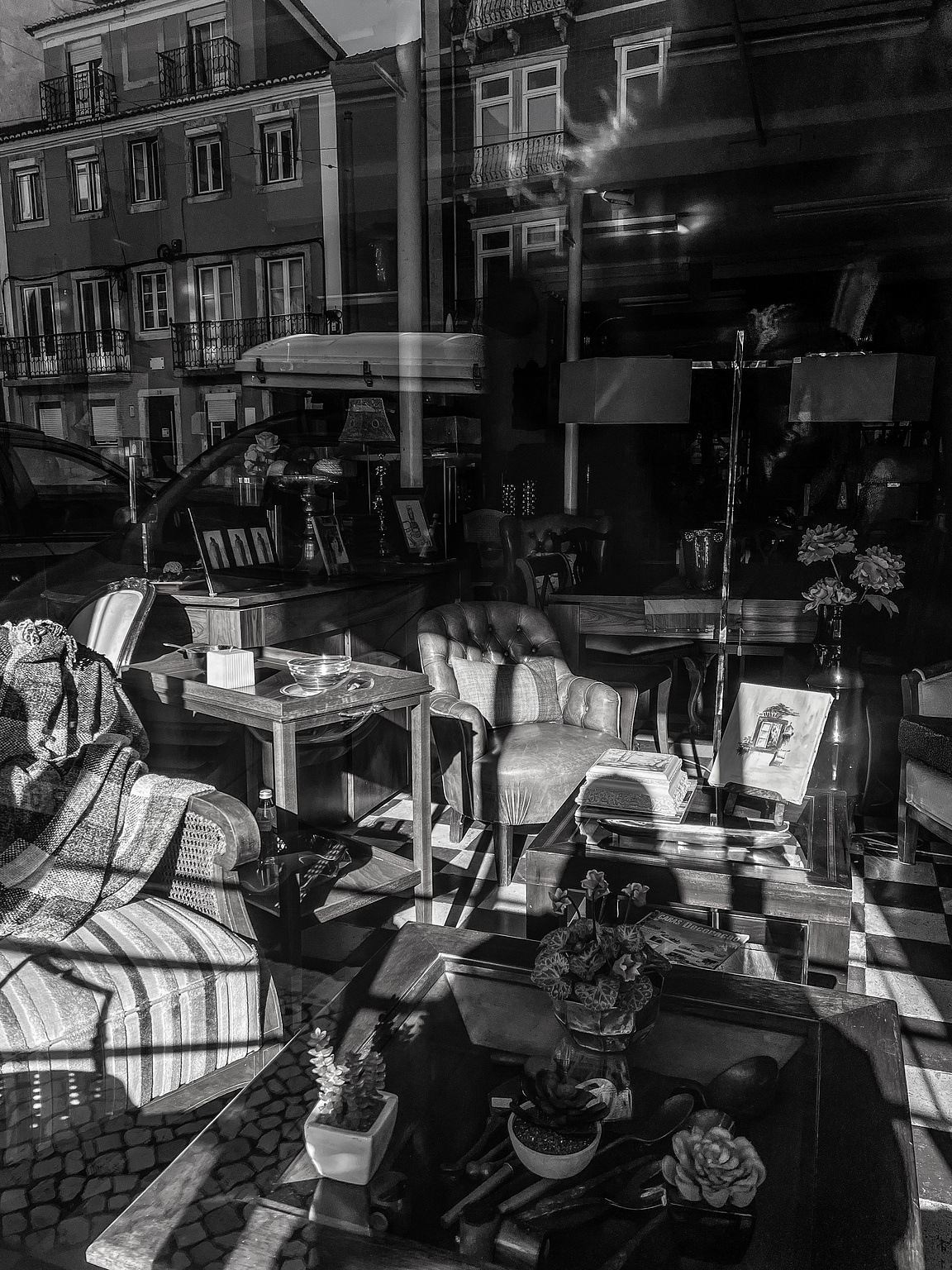 A shop window, with the street reflection 