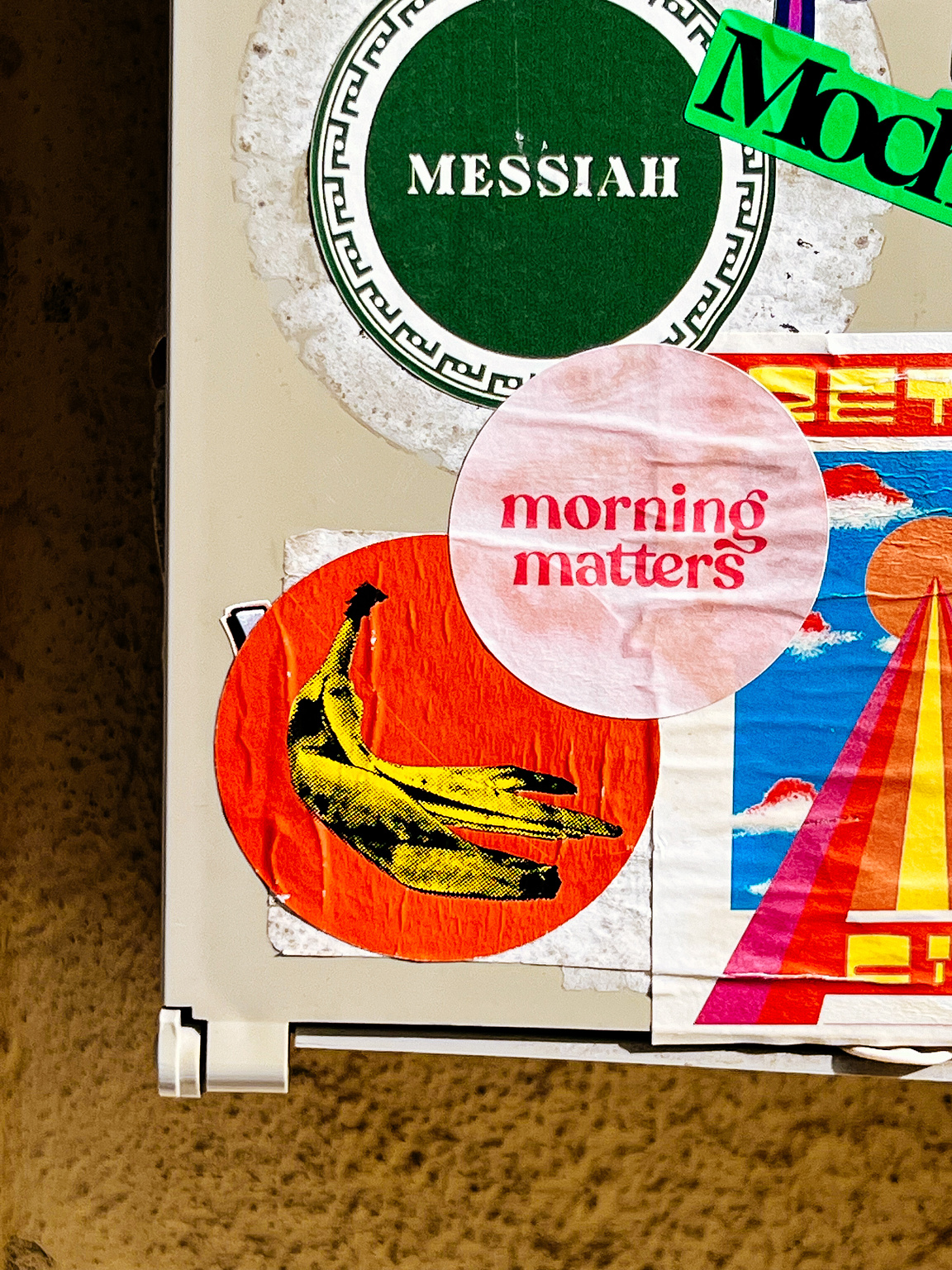 "morning matters", and a bunch of other stickers. a banana. 