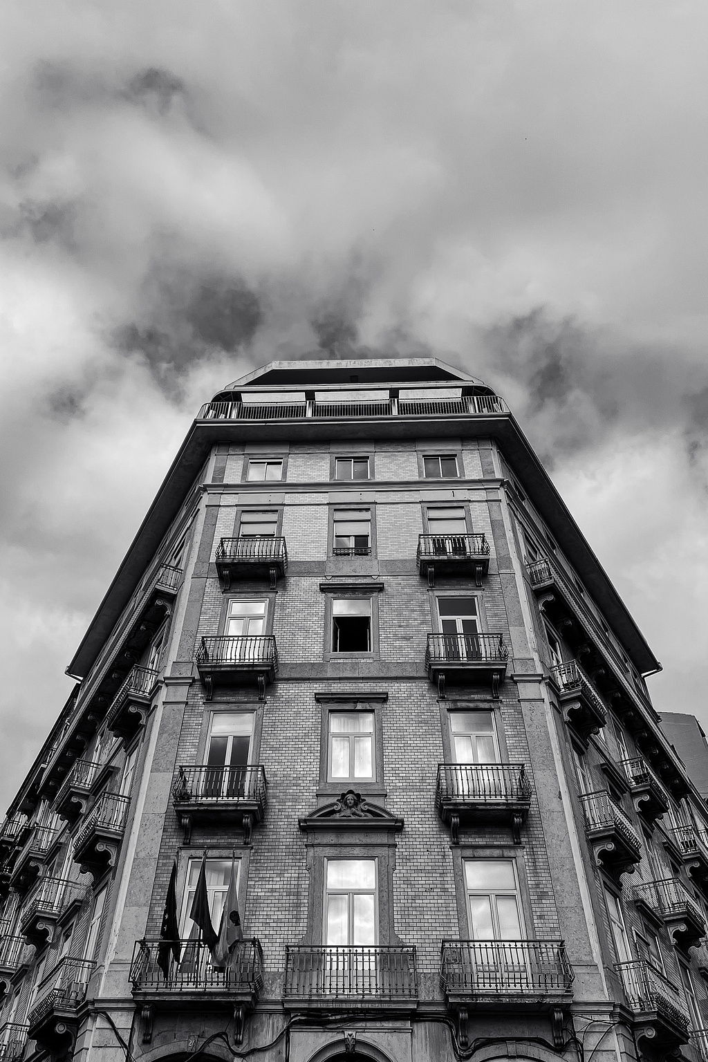 A building. One open window only. 