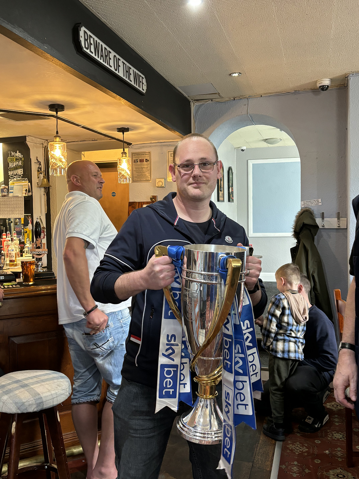 Me holding the EFL League Two champions cup.