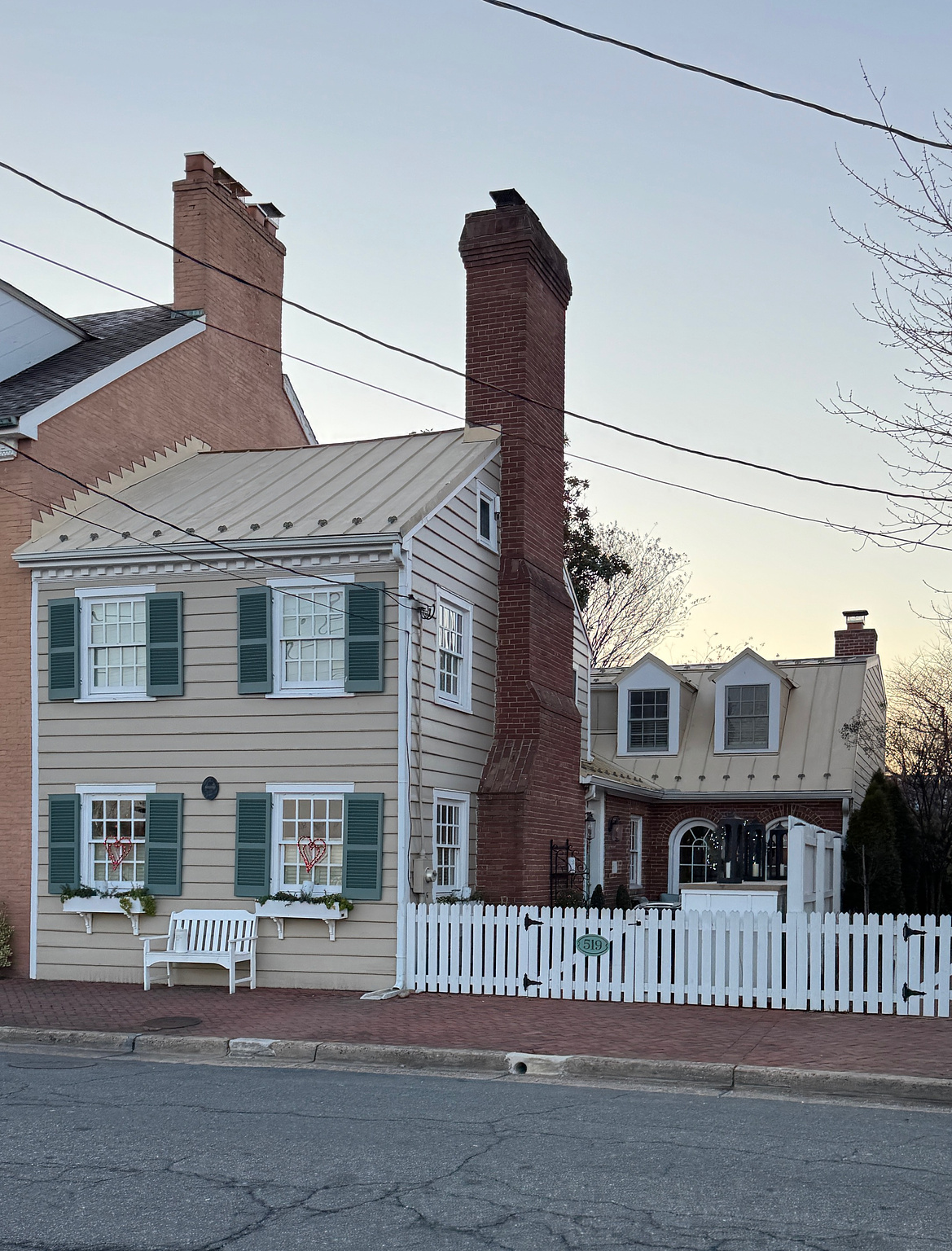 historic Tran home with a white picket fence