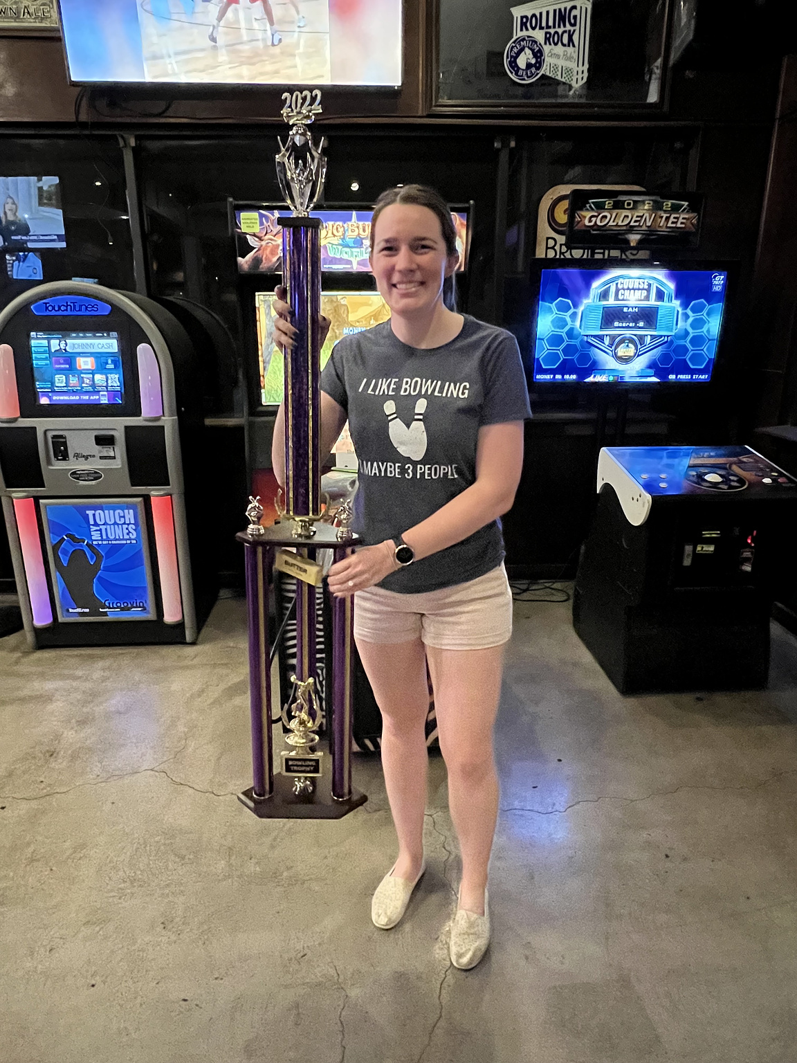 The bowling trophy after its unveiling. It's nearly as tall as she is!