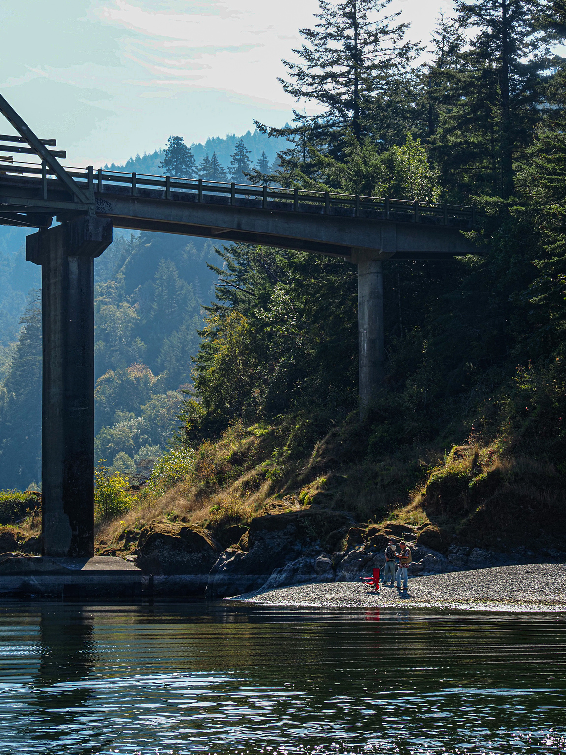 Fishermen underneath a bridge, Rogue River