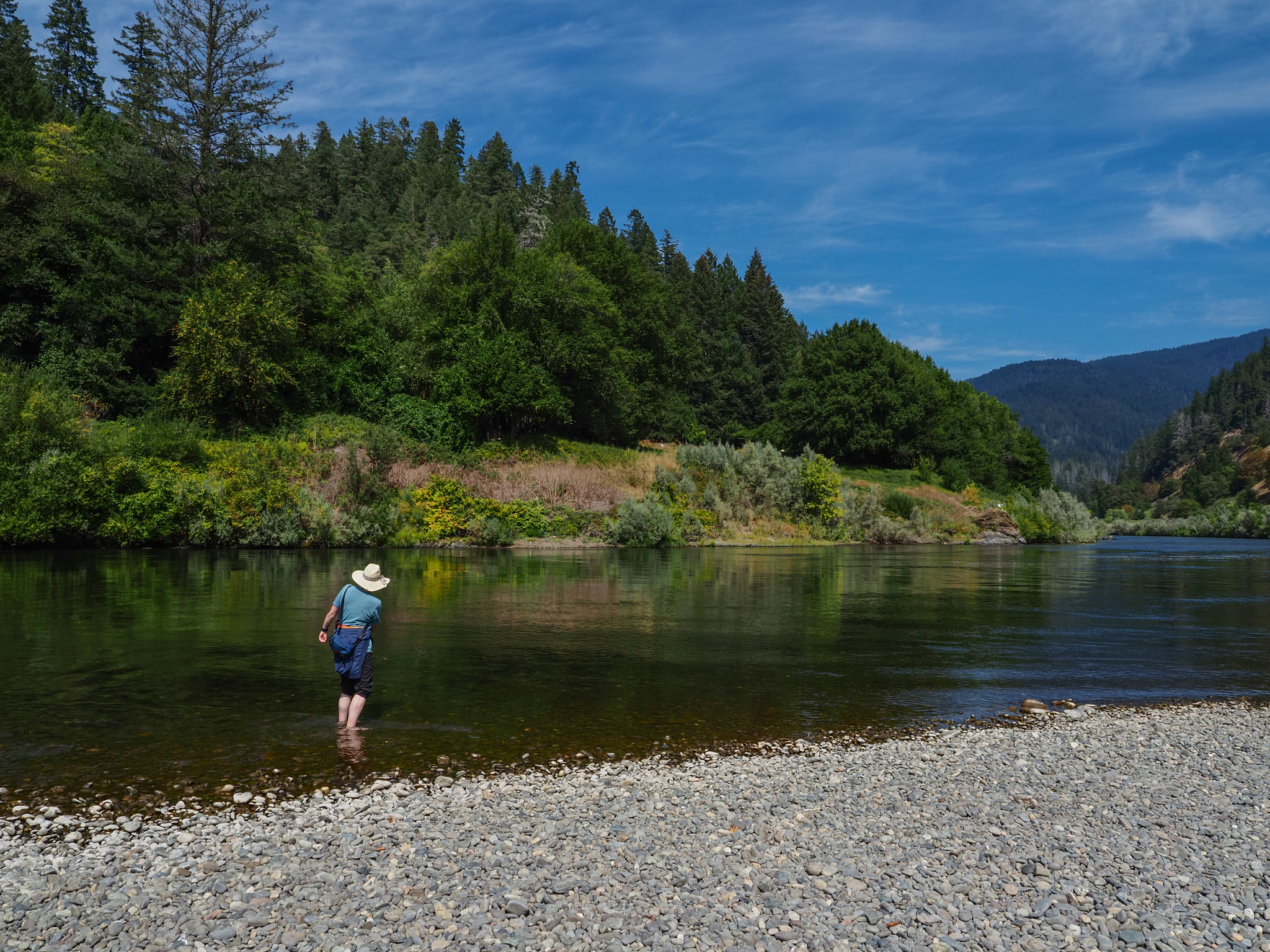 Al skips a rock in the river at Agness.