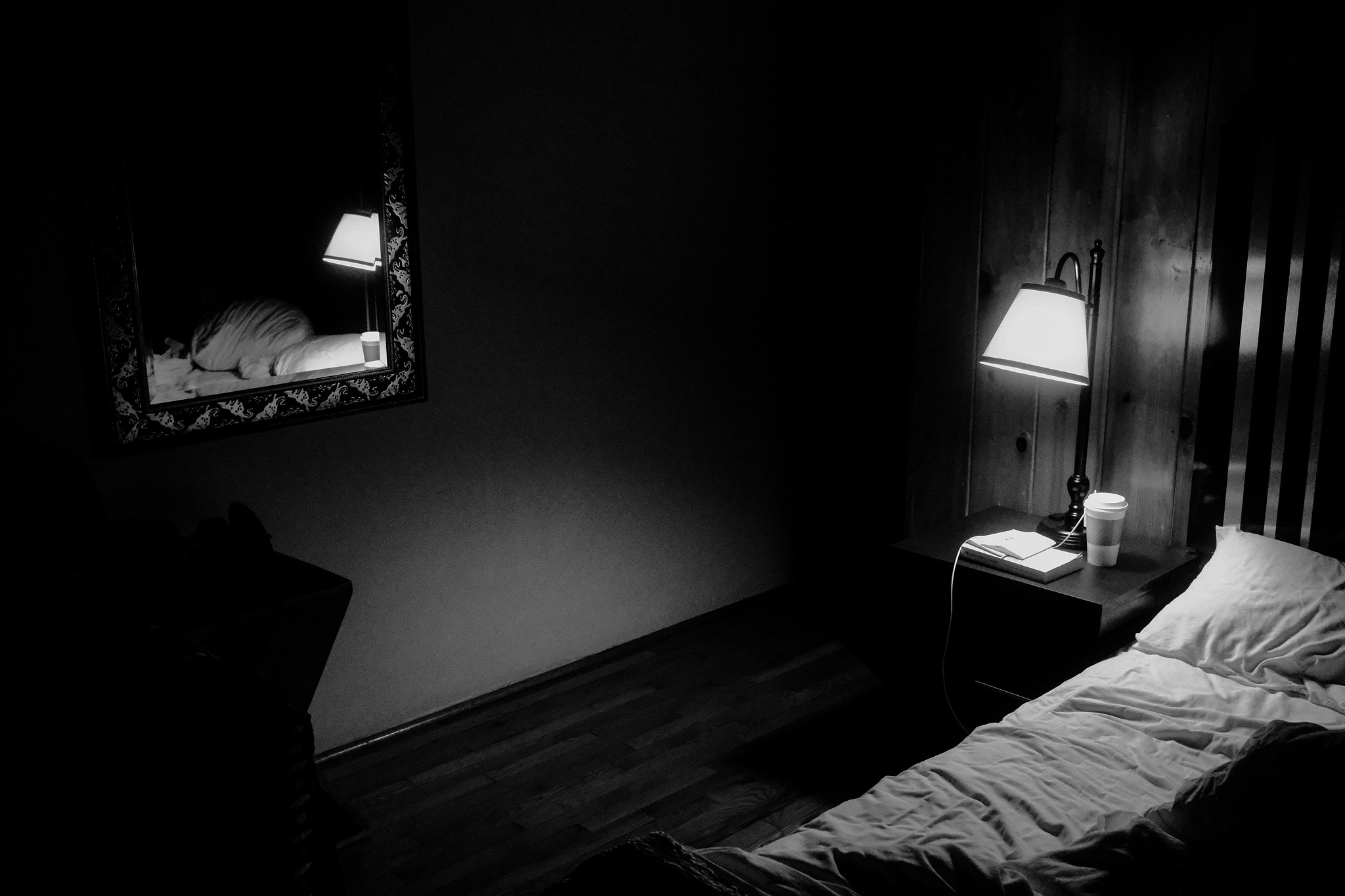 Monochrome. A hotel bed. 