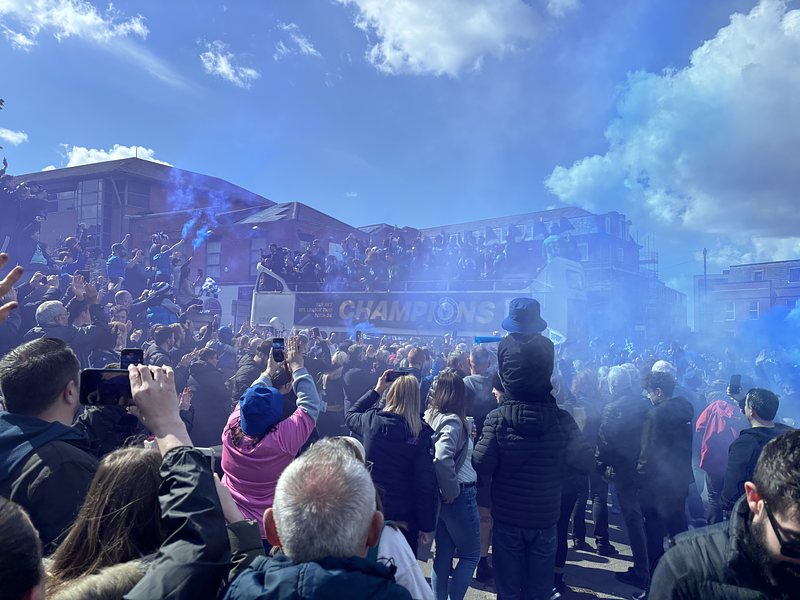 The open top bus with Stockport County players showing off their champions cup.