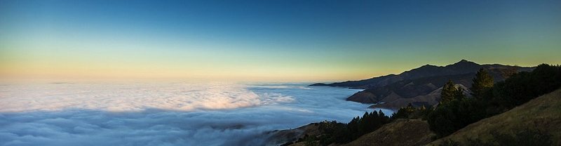 Sunrise over a fogged in valley