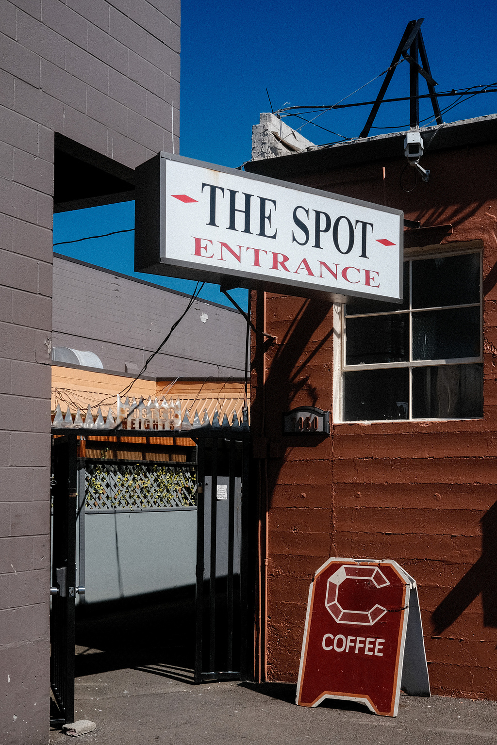 A sig reading "The Spot - Entrance" over a sandwich board for Carnelian Coffee. 