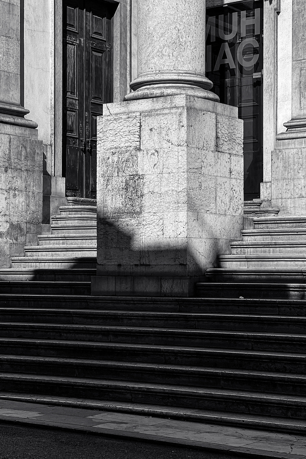 A marble column, outside a museum.